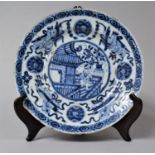 An 18th/19th Century Chinese Porcelain Plate with Central Decoration Depicting Robed Gent Outside