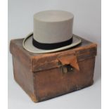 A Late 19th Century Leather Hat Box Containing a Later Grey Top Hat, 35cm wide