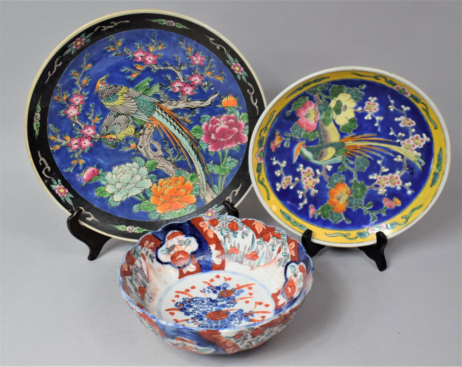 A Japanese Imari Bowl and Two Mid 20th Century Chinese Polychrome Decorated Chargers