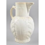 A Large Creamware Mask Head Jug, Body Decorated in Relief with Leaves, 33cm High