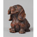 A Carved Wooden Study of a Seated Puppy, 6cm high