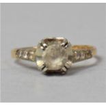 An 18ct Gold and White Stone Solitaire Dress Ring, 2.1g