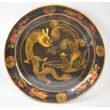 A Large Chinese Lacquered Wall Hanging Charger with Gilt and Red Enamel Decoration, 58.5cm Diameter