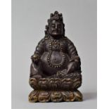 A Tibetan Carved Wooden Study of Jambhala, God of Wealth, In the Seated Position with Left Hand