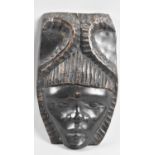 A Carved Tribal Mask, 26cm high