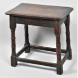 A Rectangular Oak stool with Turned Supports, 41.5x21.5cm