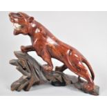 A Carved Wooden Oriental Study of a Lioness, 21cm Long