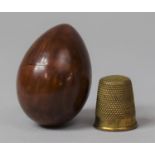 A Burrwood Ovoid Thimble Case with Thimble, 4cm High