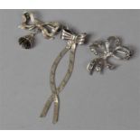 A Collection of Three Silver Ribbon Bow Brooches