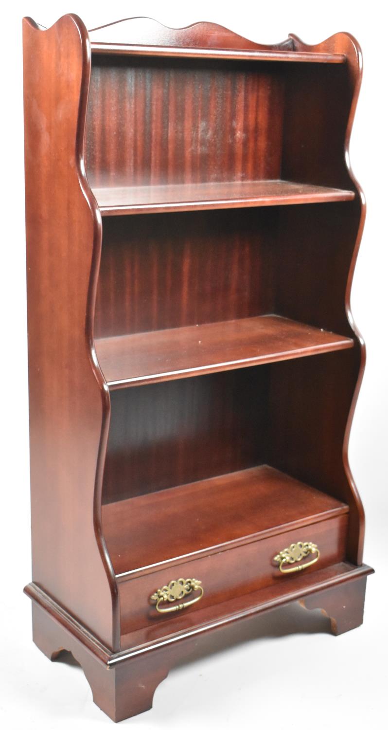 A Reproduction Mahogany Waterfall Bookcase with Base Drawer, 59cm wide and 111cm high