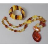 A Modern Amber Type Expandable Bracelet and Bead Necklace with Pendant