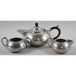 A Hand Beaten Pewter Three Piece Tea Service by Hall Brothers, Sheffield