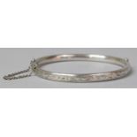 A Silver Bangle with Safety Chain