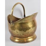 A Mid 20th Century Brass Helmet Shaped Coal Scuttle