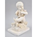 A Cast Plaster Study of a Seated Cherub with Grapes and Bird Taking Fruit, Marble Plinth Base,