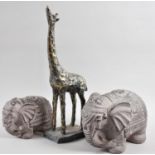 Two Graduated Stoneware Elephants and a Resin Study of a Giraffe, 35cm high