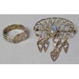 A White Metal and Moonstone Brooch and a Continental Silver Ring with Etched Decoration