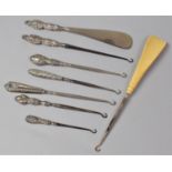 A Collection of Six Silver Handled Button Hooks, Silver Handled Shoe Horn and Combination Shoe