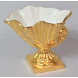 A Crown Devon Gilded Cornucopia Shaped Vase, 12cm high