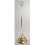 A 19th Century Brass Door Porter with Weighted Base, 54cm high