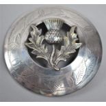 A Scottish Silver Plated Circular Kilt Brooch decorated with Thistle, 9cm Diameter