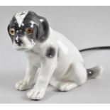 A Novelty Porcelain Night Light in the Form of Seated Puppy with Glass Eyes, 14cm high