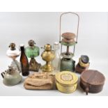 A Collection of Four Oil Lamps and One Hurricane Lamp Together with Bottles, Brush Set, Tins and