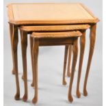 A Modern nest of three Tables, Crossbanded tops with Burrwood Centres, 54cms Wide