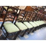 A Set of Eight Oak Ladder Back Dining Chairs