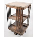 An Edwardian Oak Revolving Bookcase, One Side Lath AF, 47cms Square and 79cms High