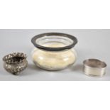 A Small Silver Salt on Three Ball Feet, A Silver Oval Napkin Ring and a Silver Mounted Dressing