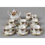 A Miniature Royal Albert Old Country Roses Tea Set comprising Six Cups and Saucers, Teapot, Cream