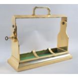 A Modern Brass Three Bottle Tantalus Frame, with Key, 34cms Wide
