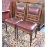 A Pair of Hide Upholstered Edwardian Oak Framed Side Chairs