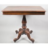 A Victorian Mahogany Rectangular Topped Occasional Table on Four scrolled Feet Culminating in