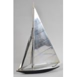 An Art Deco Chromed Metal Model of a Racing Yacht in Full Sail, 34cms High, Sail Requires Refixing