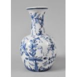 A Blue and White Floral Decorated Vase, 19.5cms High