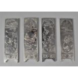 A Collection of Four Chinese Silver Plate on Copper Ingots/Scroll Weights Decorated in Relief with