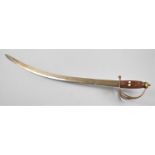 An Indian Curved Blade Sword with Etched Decoration and Wooden Handle, Brass Guard, 90cms Long