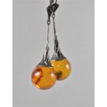 A Pair of Amber and Silver Drop Earrings (One Bead AF)