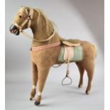 A Vintage Childs Toy Rocking Horse, Missing Stand and One Leg Requires Repair, with Saddle and