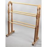 A Reproduction Stripped Pine Victorian Style Towel Rail, 67cms Wide