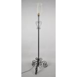 A Modern Wrought Iron Tripod Standard Lamp