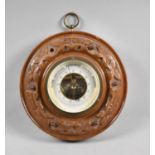 An Edwardian Circular Carved Oak Aneroid Barometer, 18cms Diameter