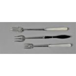 A Collection of Two Mother of Pearl Handled Silver Food Forks ad One with Scottish Agate Handle