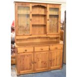 A Modern Pine Kitchen Dresser, with Three Central Drawers, Cupboards and Glazed Top Section with
