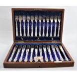 An Edwardian Mahogany Cased Canteen of Fish Knives and Forks, presented 29th June 1916, From the