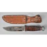 A Vintage Kinfolks Bowie Knife in Leather Scabbard, 26cms Long