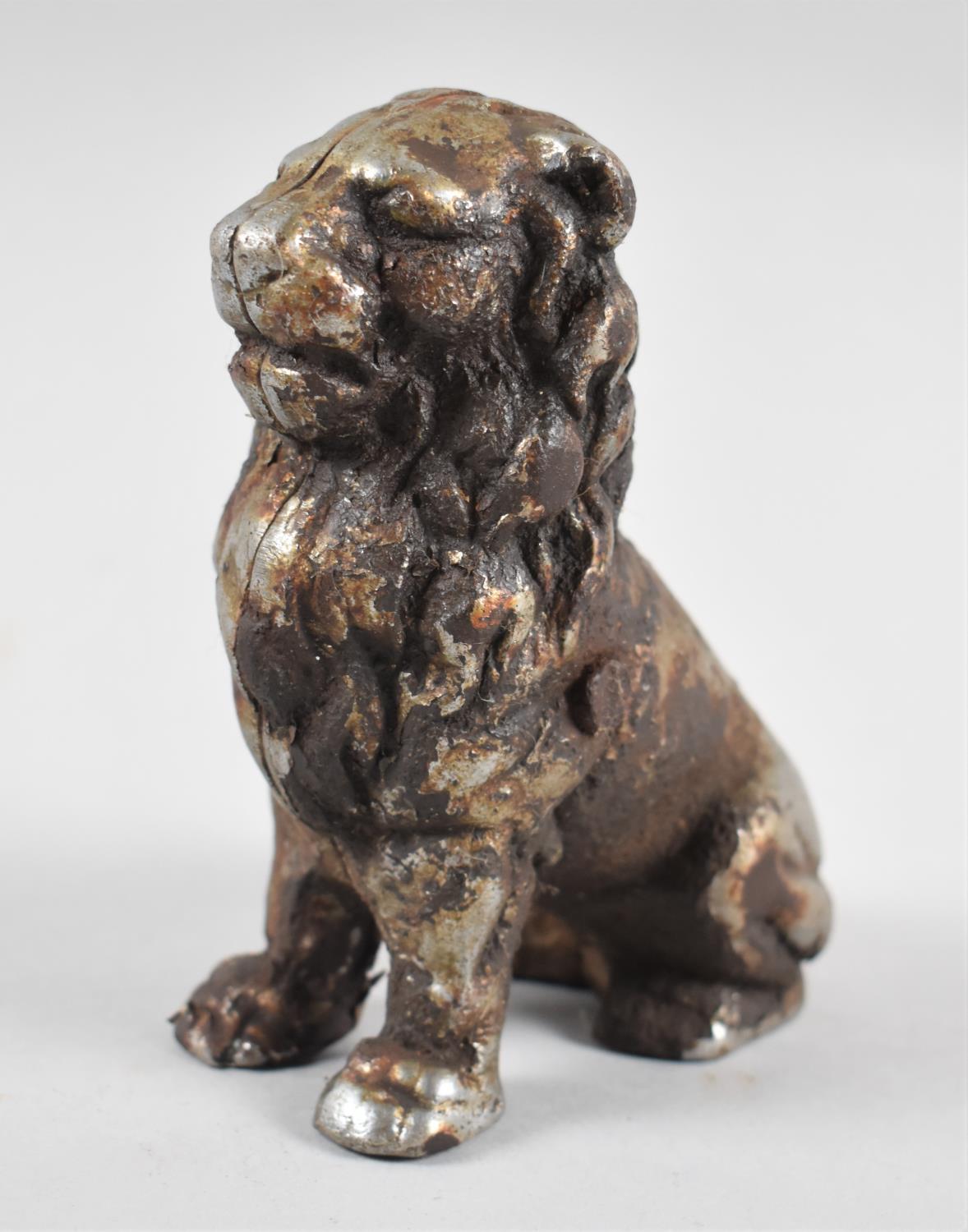 An Early 20th Century Cast Iron Novelty Money Box in the Form of a Seated Lion, 12.5cms High