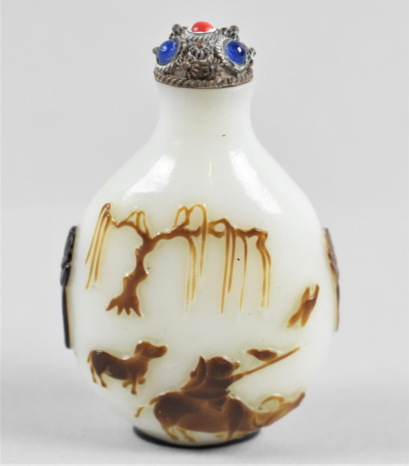 A Chinese Carved Peking Glass Snuff Bottle with Relief Carving Depicting Boy and Buffalo, White